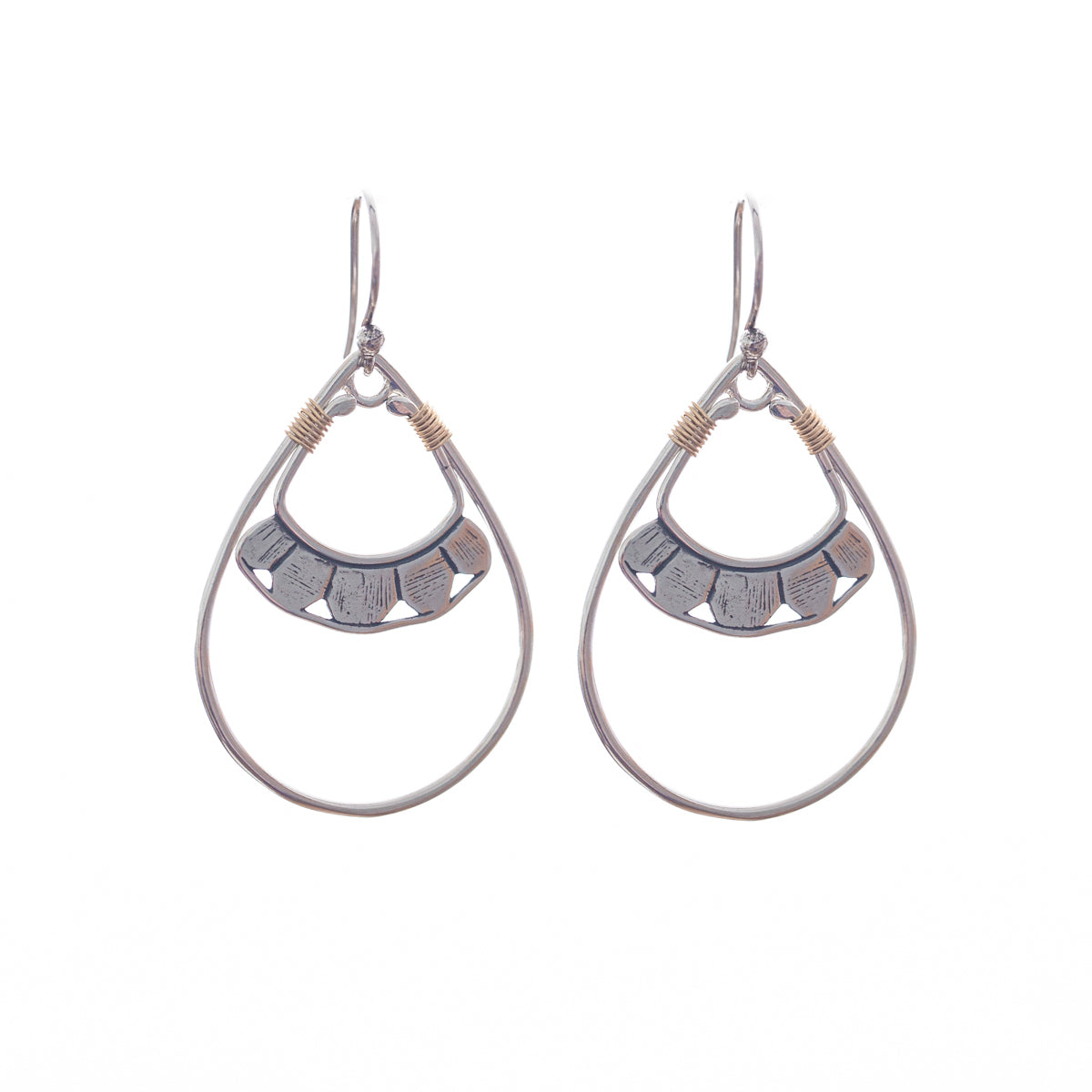 Our Pionera earrings come in silver and gold, a Bronwen Jewelry pick for travel and adventure