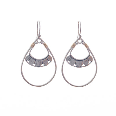 Our Pionera earrings come in silver and gold, a Bronwen Jewelry pick for travel and adventure