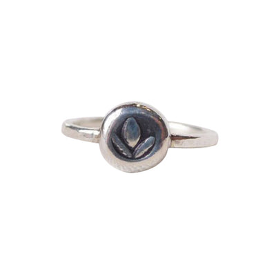 Our Tiny Charm Lotus ring is lightweight and strong, a Bronwen Jewelry staple for your active lifestyle